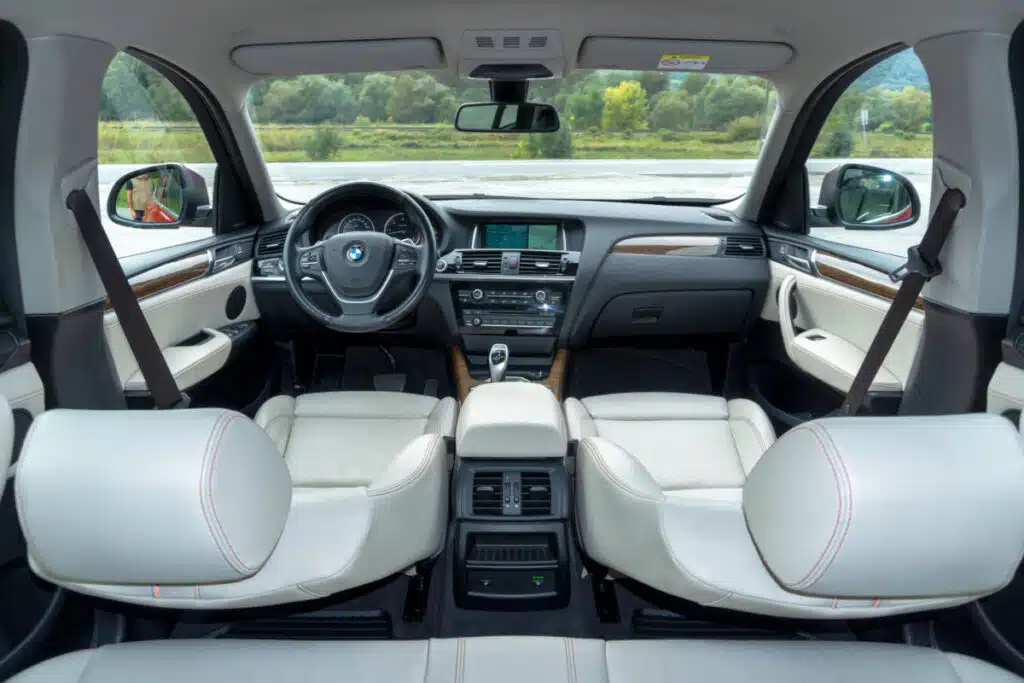 BMW X4 luxury crossover SUV with white, cream upholstery leather interior,