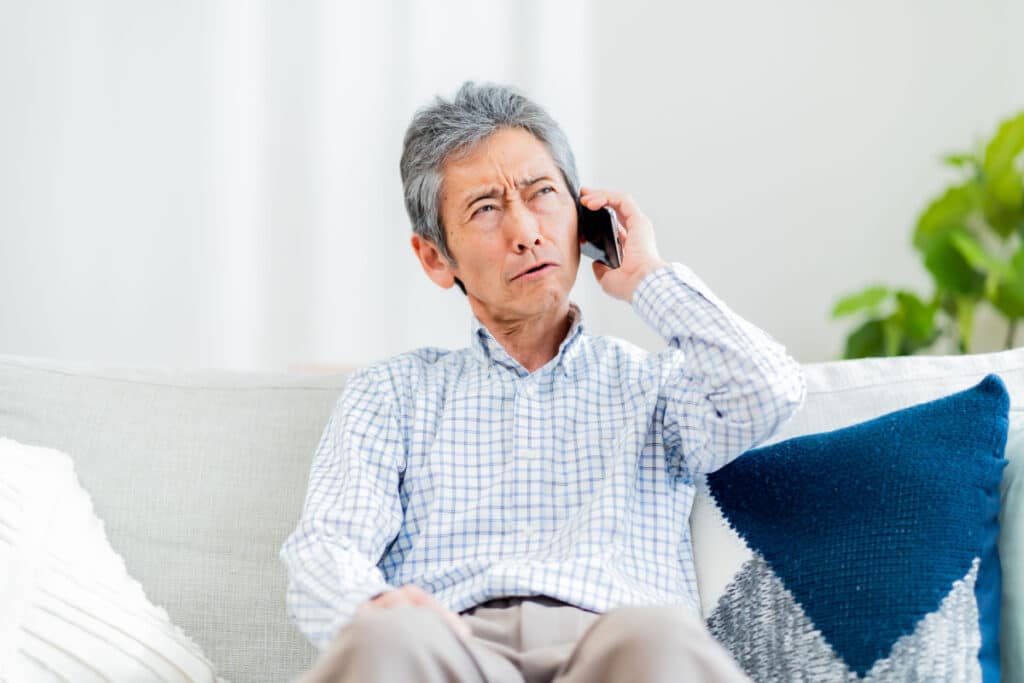 Man upset with a phone call, representing the Direct Energy telemarketing calls class action.