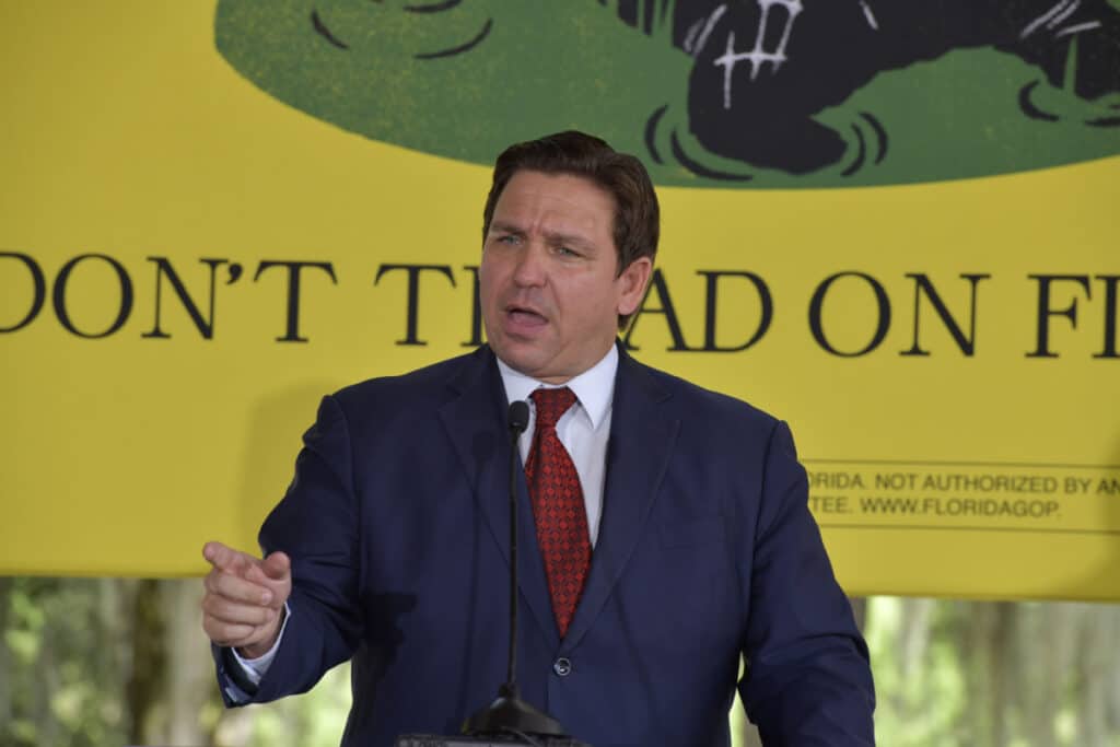 Ron DeSantis speaking at a podium, representing the abortion ban in Florida.
