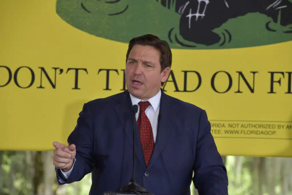 Ron DeSantis speaking at a podium, representing the abortion ban in Florida.