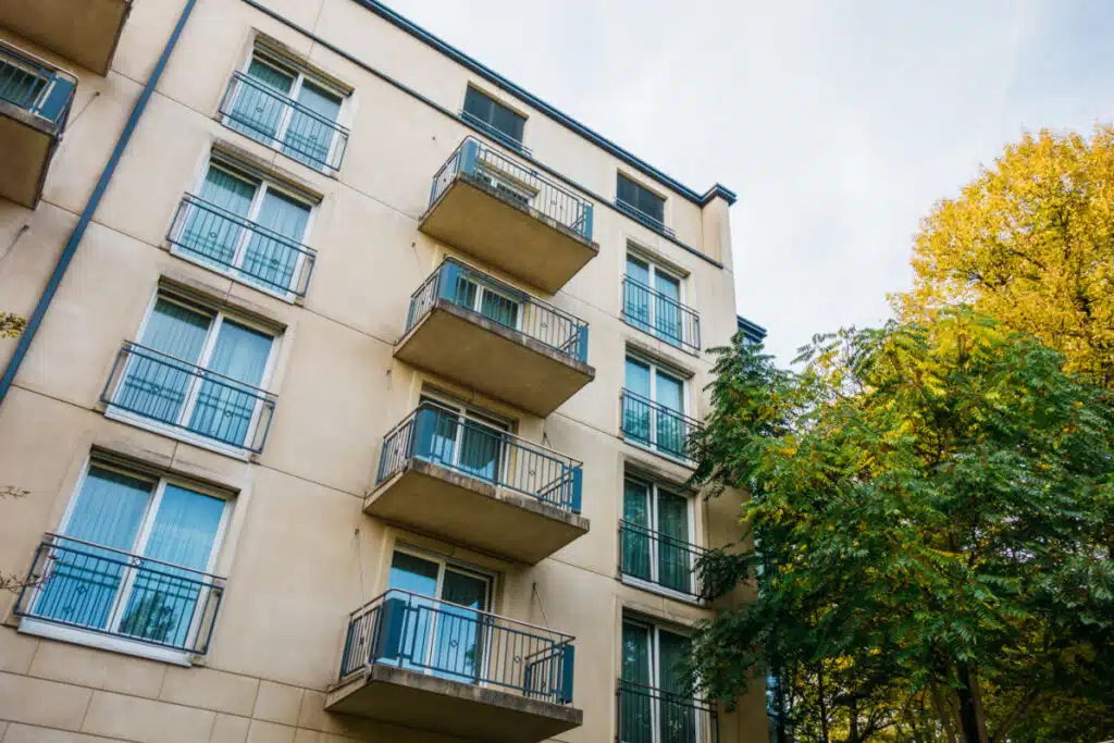 Orange apartment house in autumn, representing the Global Ministries Foundation class action