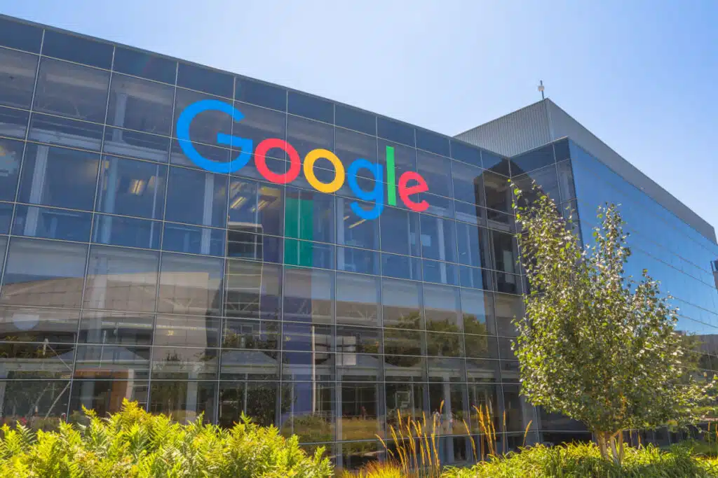 Google sign outside glass building