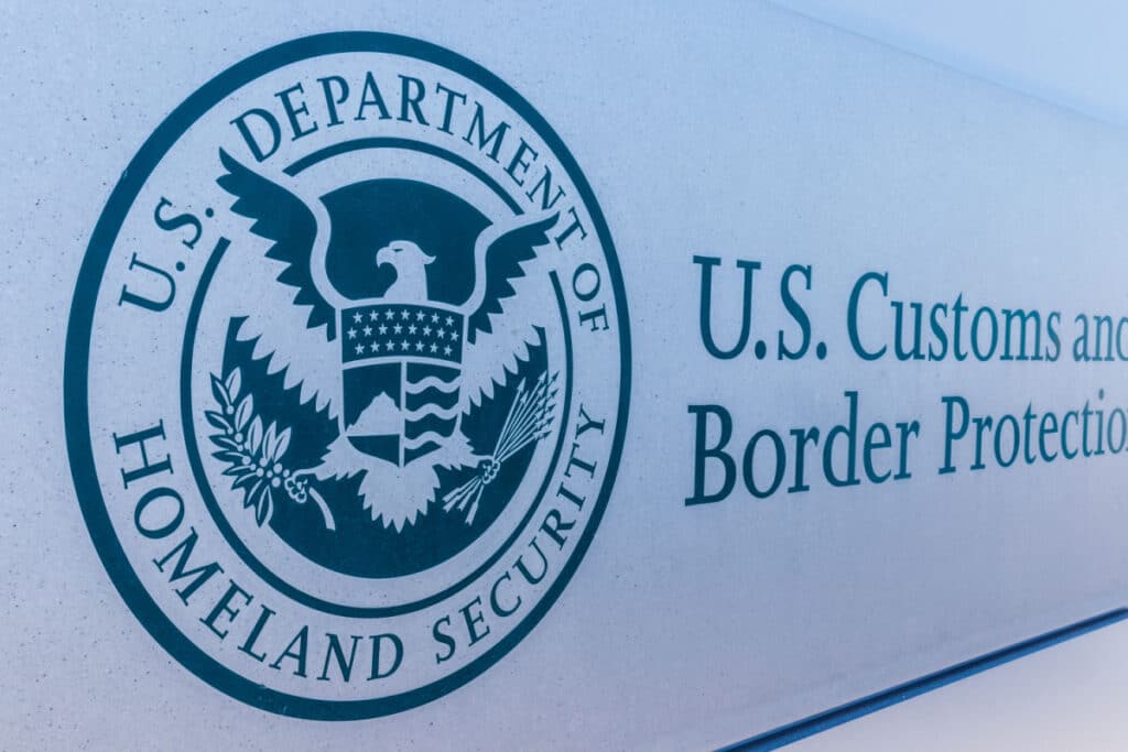 U.S. Customs & Border Protection sign, representing the ICE workforce immigration raid settlement