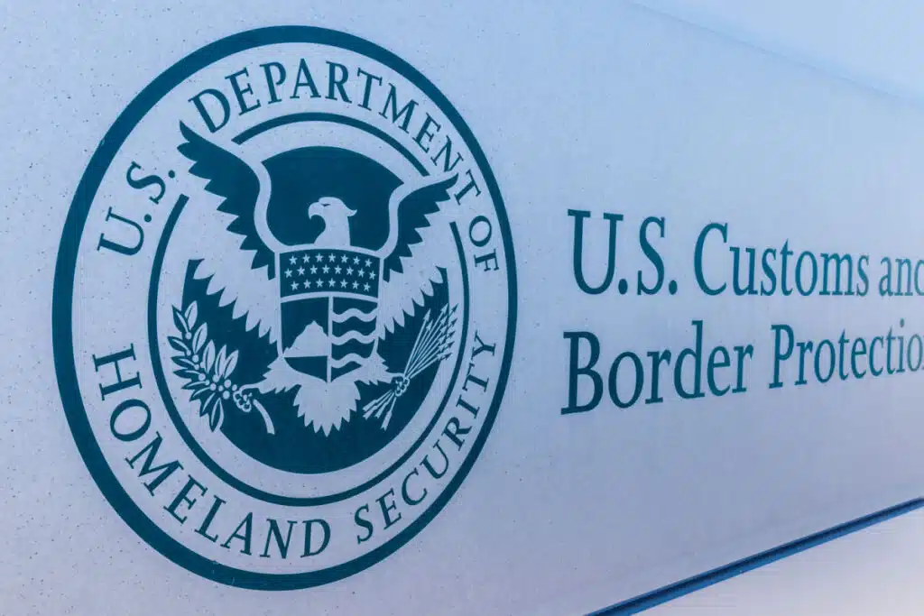 U.S. Customs & Border Protection sign, representing the ICE workforce immigration raid settlement