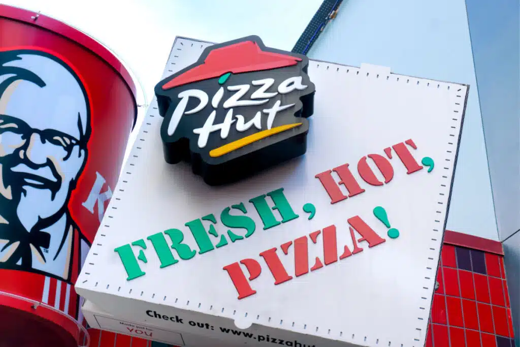 KFC bucket next to a Pizza Hut pizza box representing the KFC and Pizza Hut data breach.