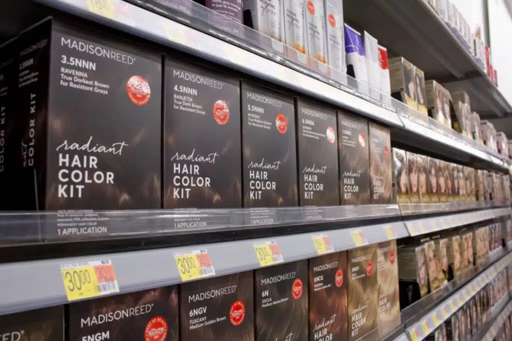 Boxes of Madison Reed hair dye on store shelf representing the Madison Reed class action lawsuit.