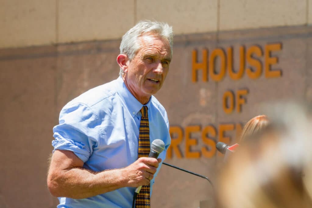 Robert F Kennedy with a microphone