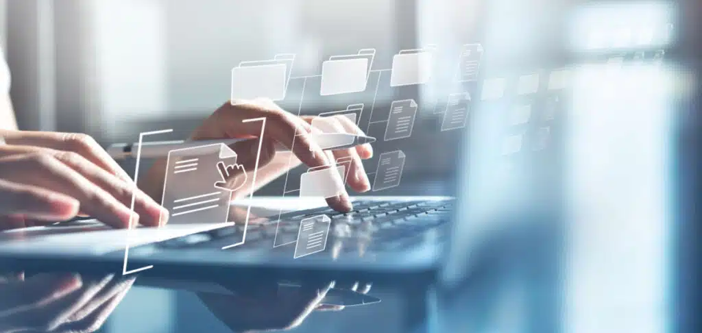 A person working on a computer representing the Sound Generations data breach class action lawsuit settlement.