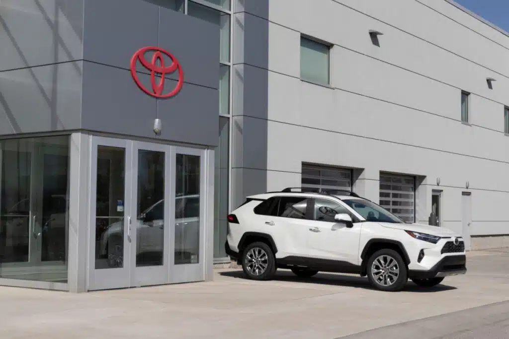 Toyota Rav4 parked outside of a Toyota Dealership
