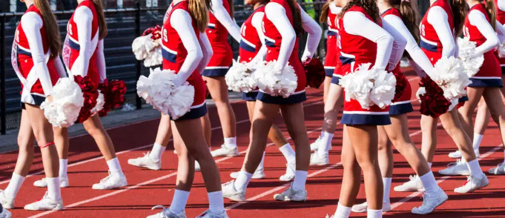 Cheerleaders cheering on the field