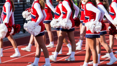 Cheerleaders cheering on the field