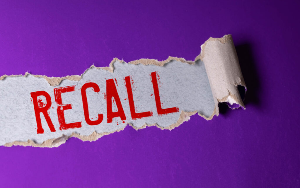 The word "Recall" spelled out in Red on purple background