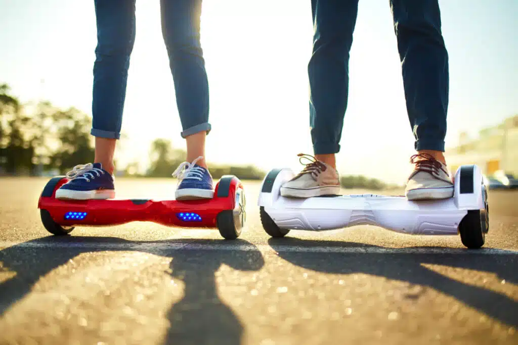 Two people standing on hoverboard