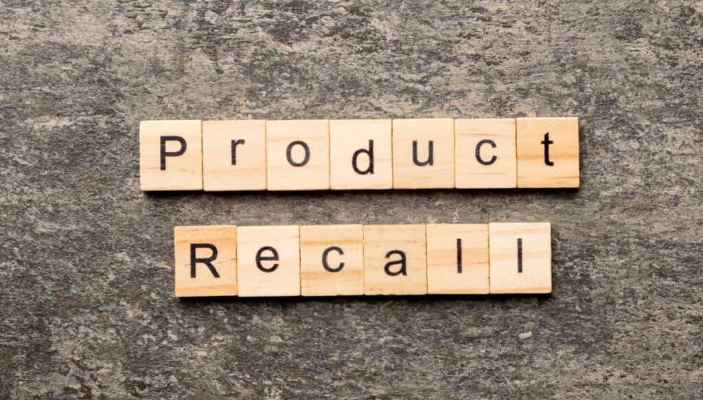 product recall word written on wood block.
