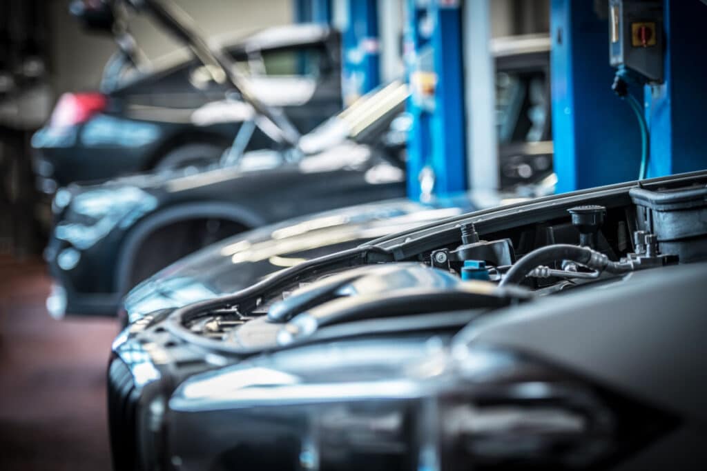 Vehicles in an auto shop getting fixed