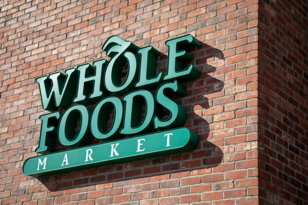 Whole Foods sign on brick building