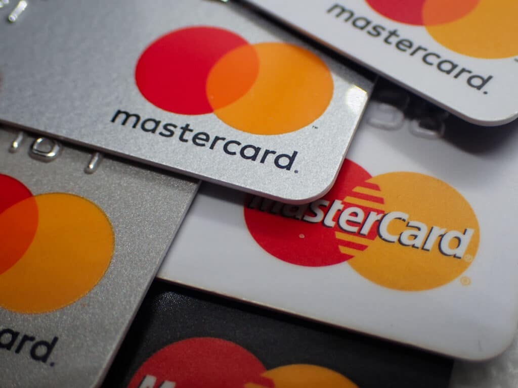 Close up of a pile of mastercard credit load debit bank cards.