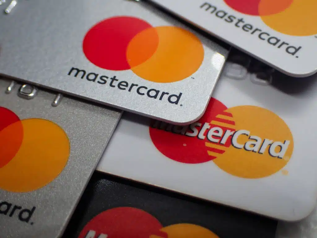 Close up of a pile of mastercard credit load debit bank cards.