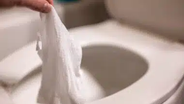 Disposable wipes being flushed down a toilet