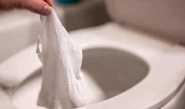 Disposable wipes being flushed down a toilet