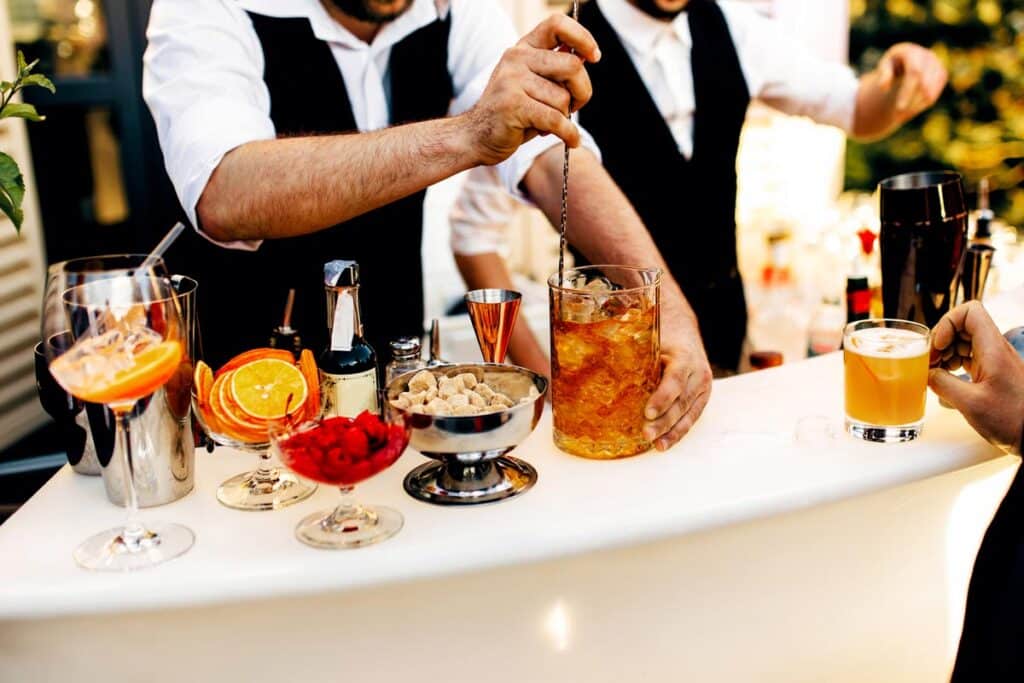 Fruit cocktails being served on a bar table, representing the Parrot Bay mini bottles class action.