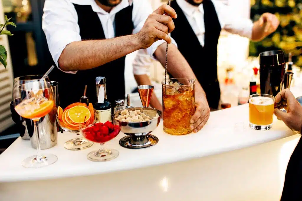 Fruit cocktails being served on a bar table, representing the Parrot Bay mini bottles class action.