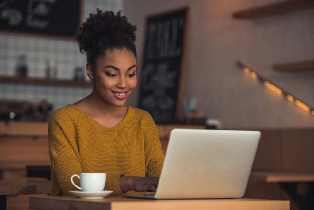 Woman using a laptop, representing the Maxim Healthcare Services data breach class action lawsuit settlement.