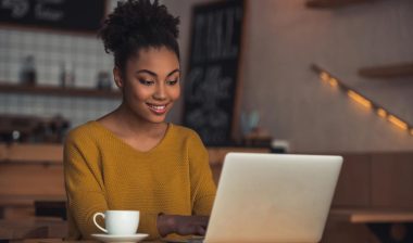 Woman using a laptop, representing the Maxim Healthcare Services data breach settlement.