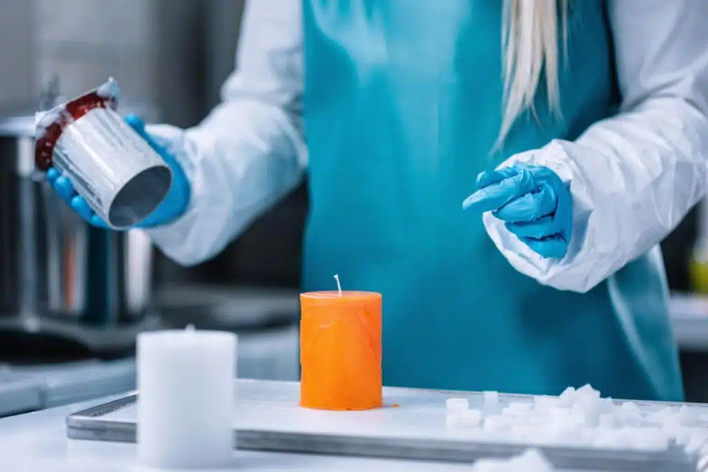 Close up of a candle worker creating candles.