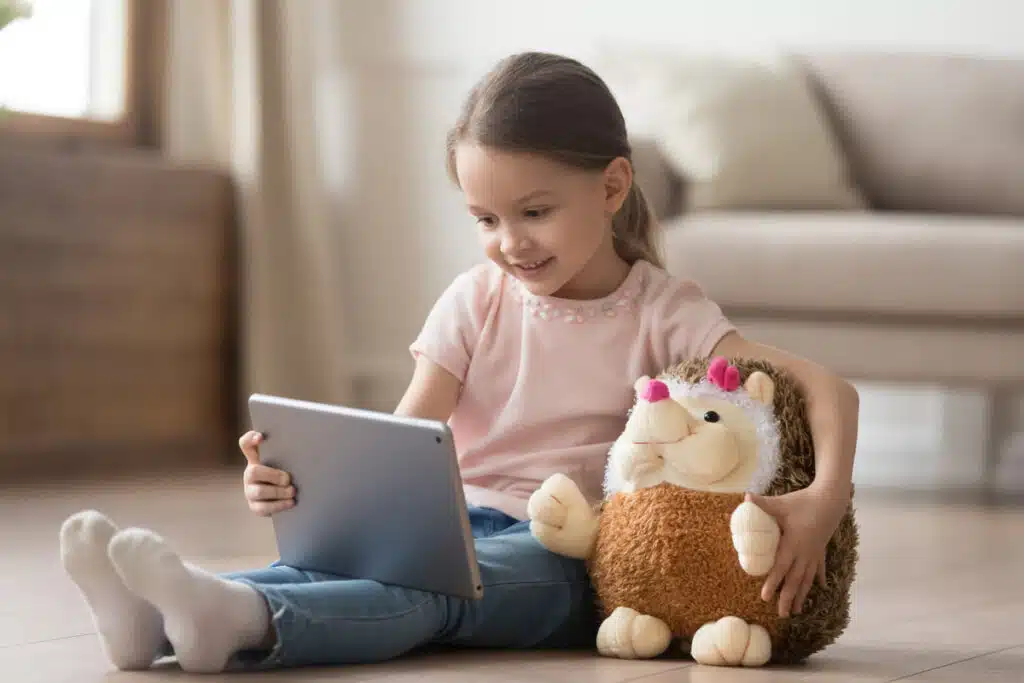 Young child using the internet on a tablet.