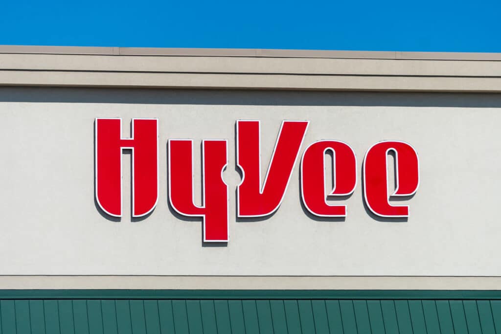 Close up of Hy-Vee signage against a blue sky.