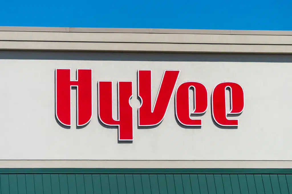 Close up of Hy-Vee signage against a blue sky.