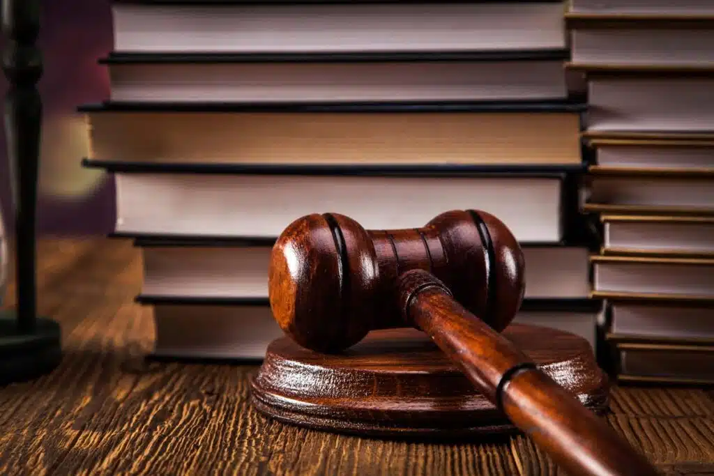 Close up of a gavel with law books, representing the North Carolina abortion law.