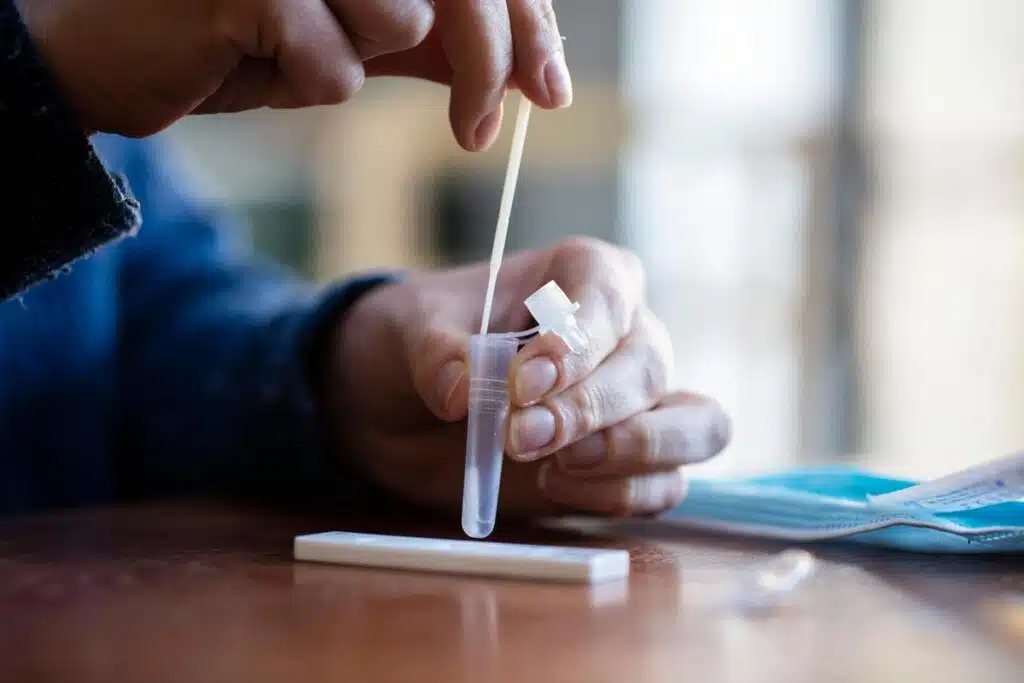 Close up of a person taking a COVID-19 test.