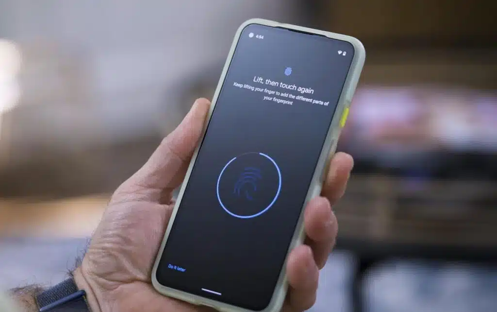 Close up of a person holding a Google Pixel 5a smartphone.