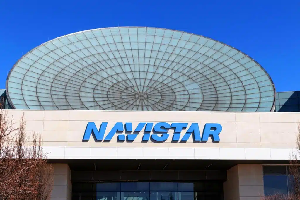 Navistar signage against a blue sky.