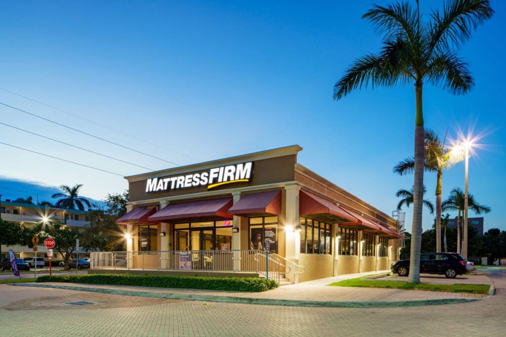 Exterior of a mattress firm location, representing the Tempur Sealy Mattress Firm deal.