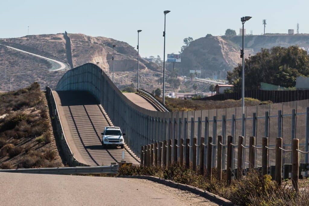 Border patrol vehicle patrolling the U.S. border, representing the Biden administration motion to move forward with migrant releases.