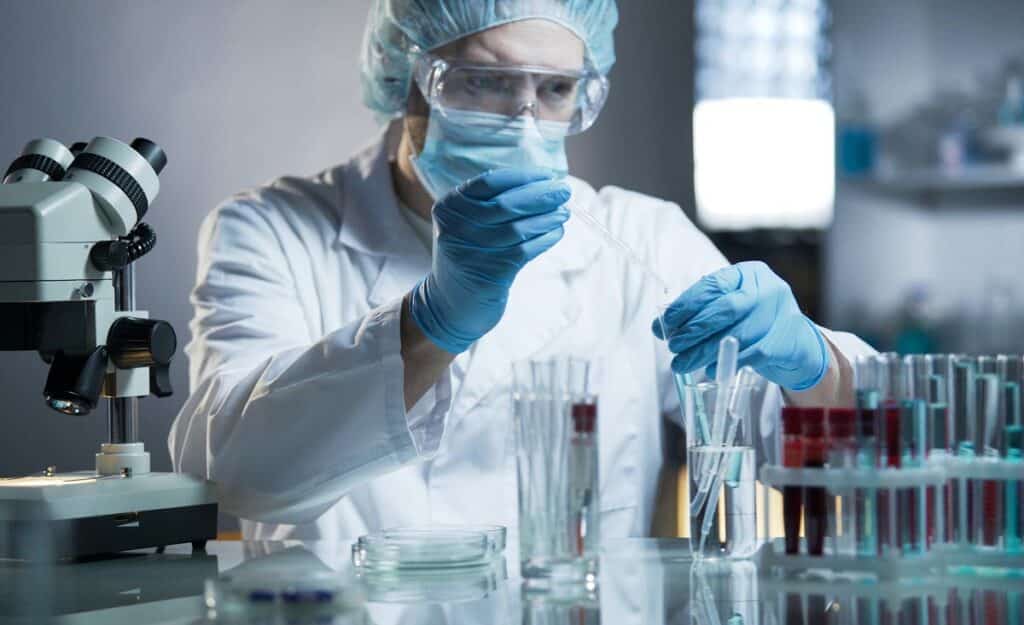 A laboratory worker working in a lab, representing the Fungi Nail class action.