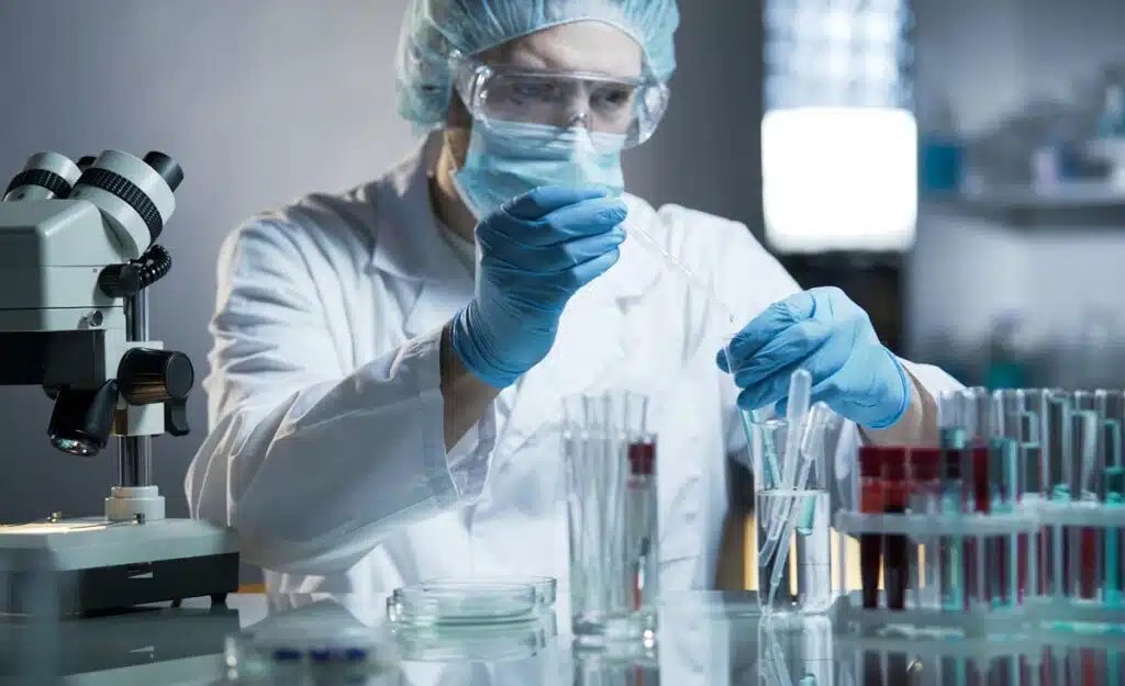 A laboratory worker working in a lab, representing the Fungi Nail class action.
