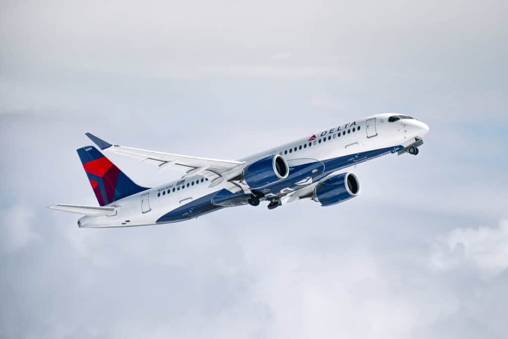 A Delta aircraft in the sky, representing the Delta class action.