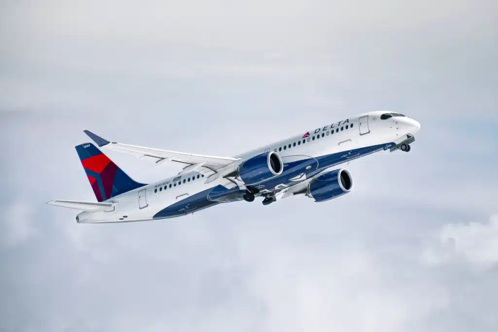 A Delta aircraft in the sky, representing the Delta class action.