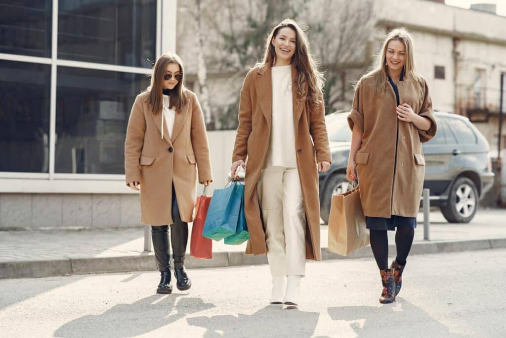 Three women walking with shopping bags, representing top recalls for the week of May 29.