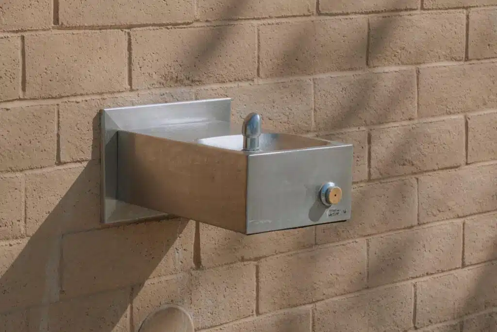 Close up of a public drinking fountain, representing the DuPont forever chemicals settlement.