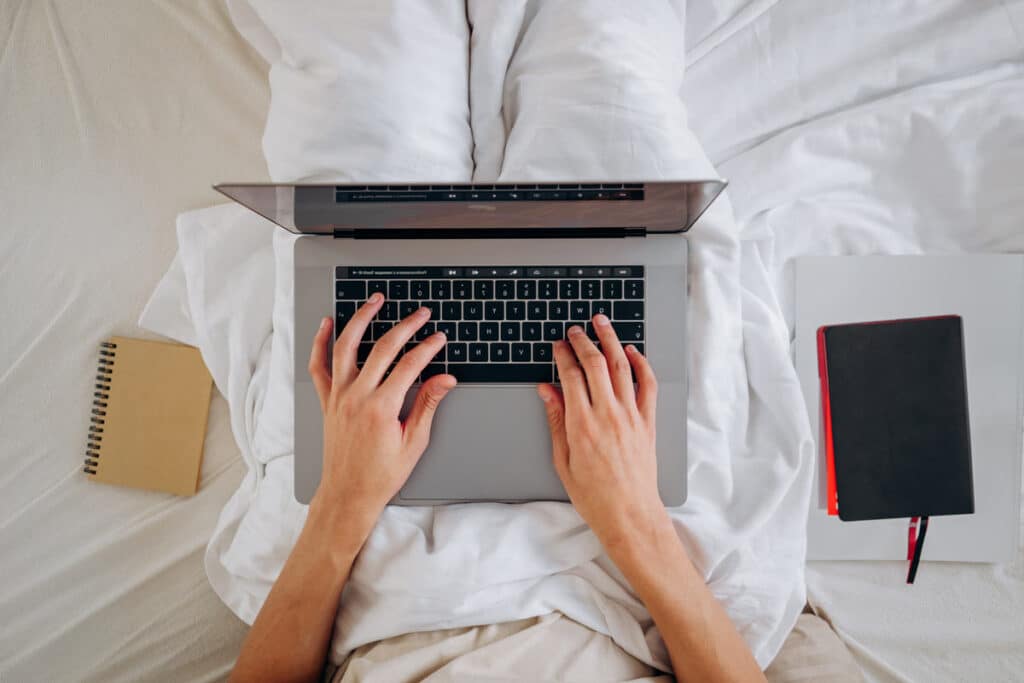 Top view of hands typing on a keyboard, representing the Arhaus class action.