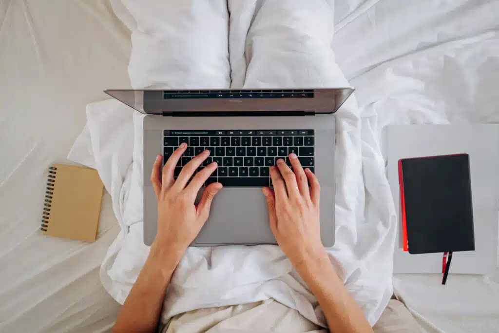 Top view of hands typing on a keyboard, representing the Arhaus class action.