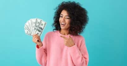 Happy woman with money in hand
