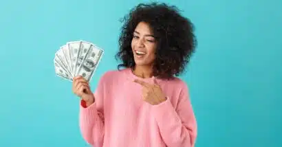 Happy woman with money in hand