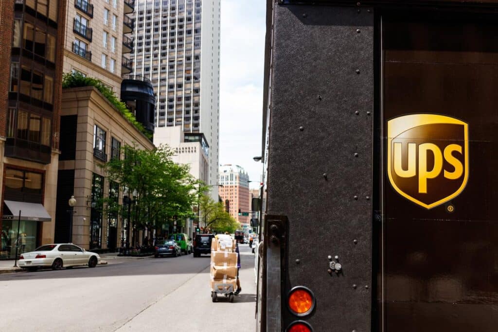 Rearview of a UPS truck in the city, representing the UPS air conditioning deal.