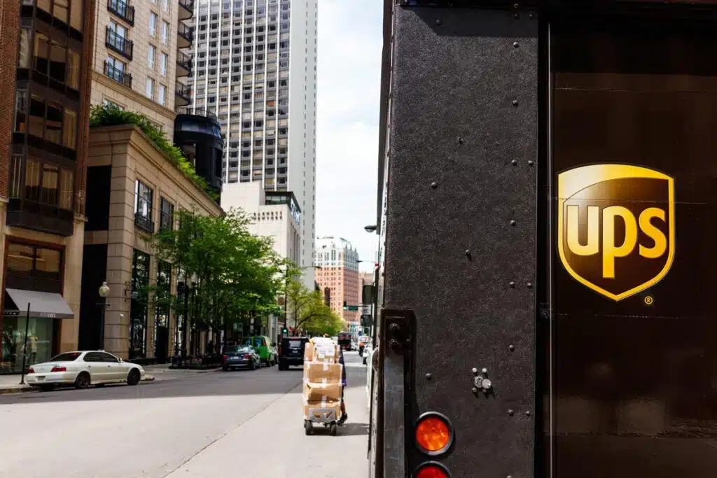 Rearview of a UPS truck in the city, representing the UPS air conditioning deal.
